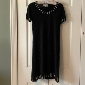 Short black sweater dress with embellishment on arms collar and bottom